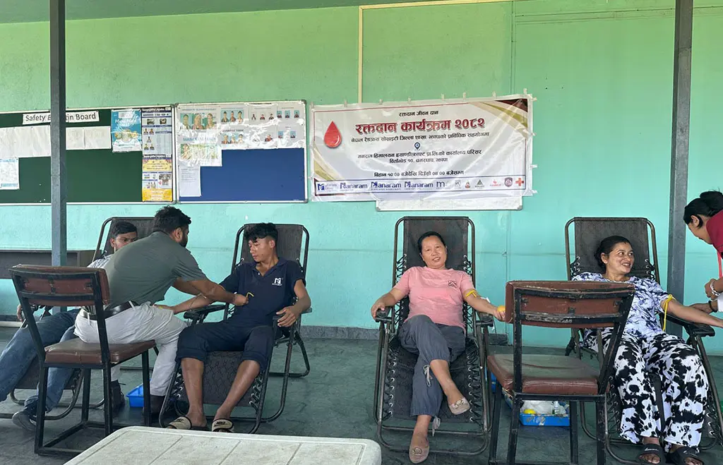 Donors resting in reclining chairs at a Manaram blood donation camp